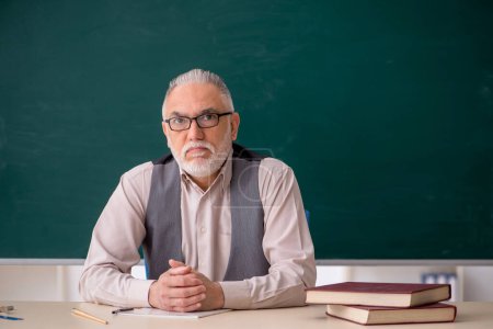 Photo for Old teacher in the classroom - Royalty Free Image