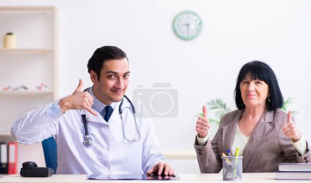 Photo for The young doctor examining senior old woman - Royalty Free Image