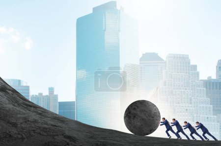 Photo for The team of people pushing stone uphill - Royalty Free Image