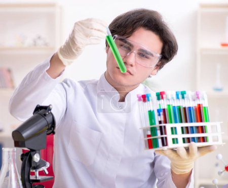 The young male biochemist working in the lab