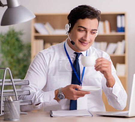 Photo for The handsome customer service clerk with headset - Royalty Free Image