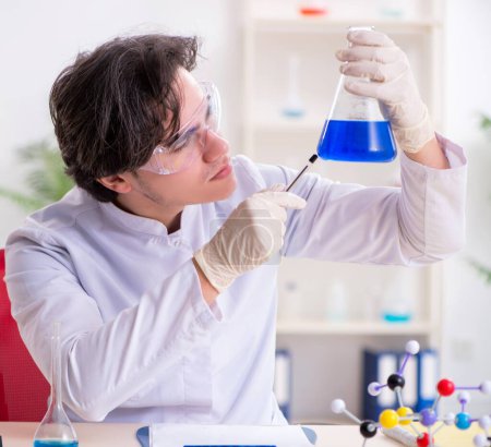Photo for The young male biochemist working in the lab - Royalty Free Image