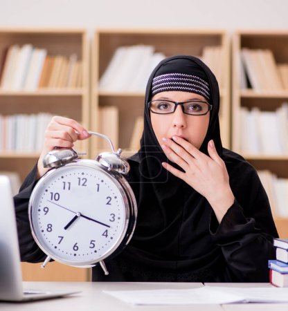 Photo for The muslim girl in hijab studying preparing for exams - Royalty Free Image
