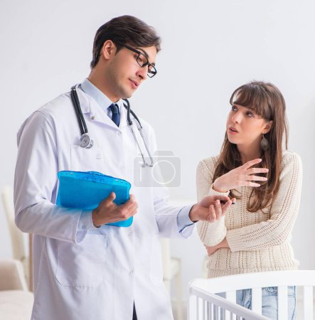 Photo for The doctor explaining to young mother - Royalty Free Image