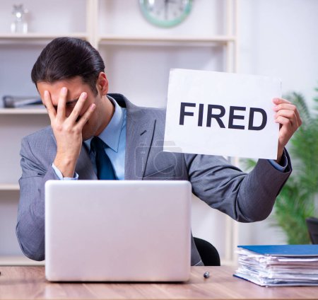 Photo for The young male employee being fired from his work - Royalty Free Image