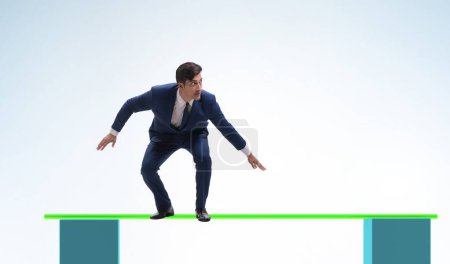 Photo for The young businessman in business concept with bar charts - Royalty Free Image