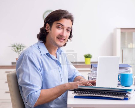 Photo for The young male employee working at home - Royalty Free Image