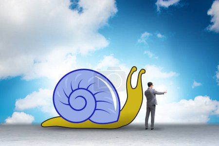 Photo for Businessman with snail in the slow business concept - Royalty Free Image