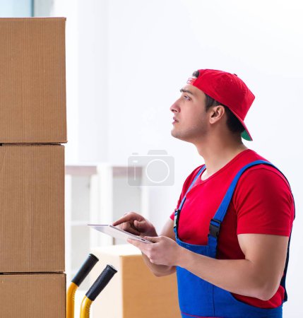 Photo for The contractor worker moving boxes during office move - Royalty Free Image