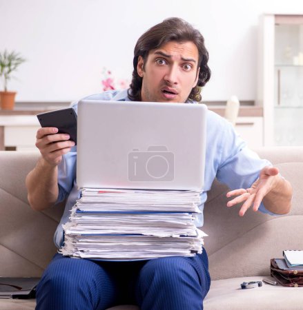 Photo for The young male employee working at home - Royalty Free Image