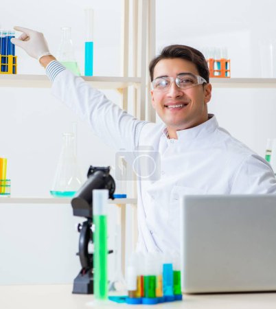 Photo for The male chemist working in lab - Royalty Free Image