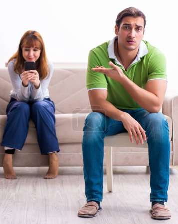 Young couple in gadget dependency disorder
