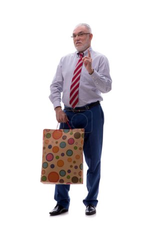Old male boss holding bag isolated on white