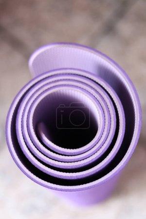 Photo for Purple yoga mat for yoga - Royalty Free Image