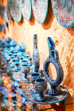 Photo for Colorful hittite wine jug and glasses for sale in Avanos pottery village in Cappadocia Turkey - Royalty Free Image
