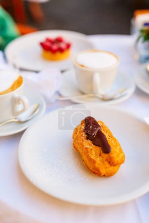 Photo for Delicious eclair with chocolate dessert beautifully served in cafe or restaurant - Royalty Free Image