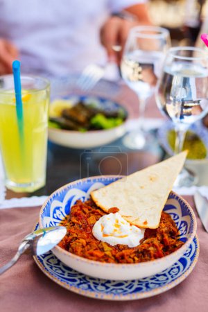 Photo for Delicious turkish appetizer fried eggplants in tomato garlic sauce served with yogurt - Royalty Free Image