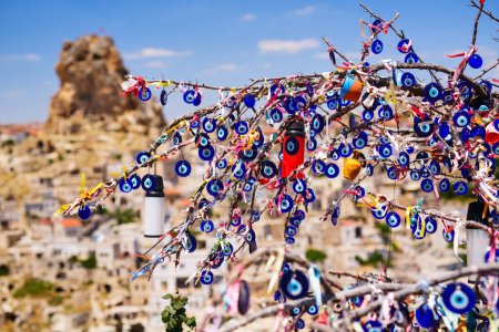 Photo for Evil eye charms hang from tree in Cappadocia Turkey for good luck - Royalty Free Image