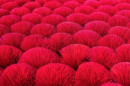 Photo for Red incense sticks drying outdoor in village near Hanoi in Vietnam - Royalty Free Image
