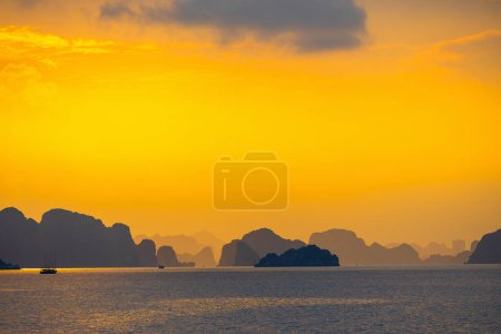Photo for Dreamy sunset landscape over islands in Halong Bay Vietnam - Royalty Free Image
