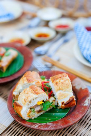 Photo for Banh Mi traditional vietnamese sandwich served for lunch in restaurant - Royalty Free Image