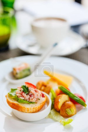 Photo for Small bites and snacks on a plate - Royalty Free Image