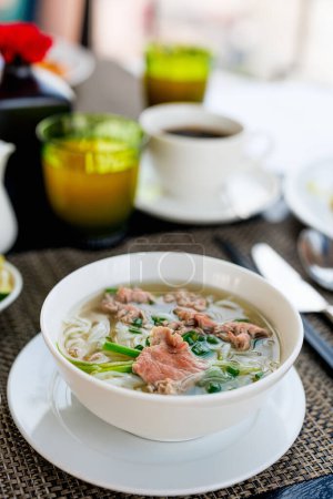 Photo for Pho Bo Vietnamese fresh rice noodle soup with beef - Royalty Free Image