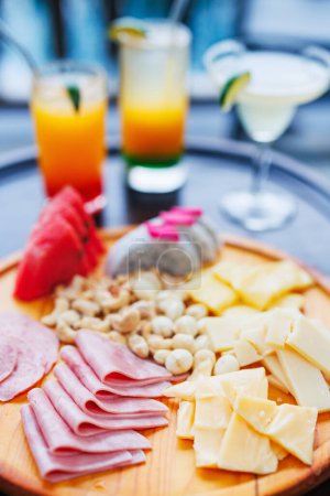 Photo for Appetizers platter with cheese and cold meat - Royalty Free Image