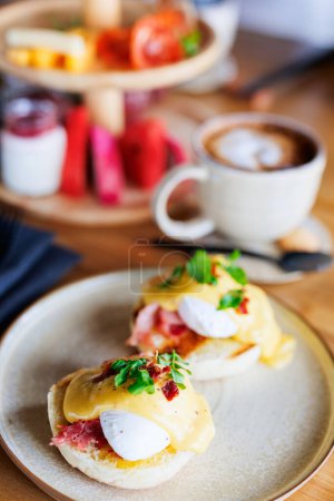 Photo for Delicious eggs Benedict breakfast served in restaurant - Royalty Free Image