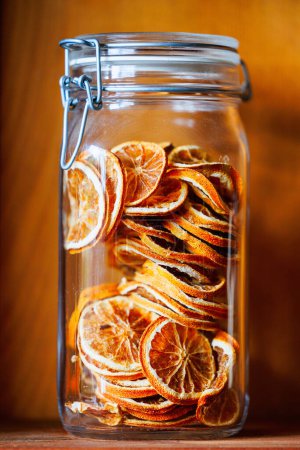 Photo for Dried orange slices in transparent jar - Royalty Free Image
