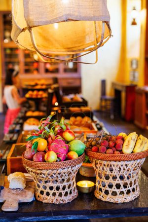 Photo for Selection of tropical fresh fruits served for breakfast in restaurant - Royalty Free Image