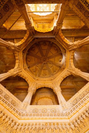 Details of dome and delicate stone carvings of 12th century Jain temple in Amar Sagar near Jaisalmer India