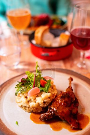 Photo for Portion of roast duck leg confit served at traditional hungarian restaurant - Royalty Free Image