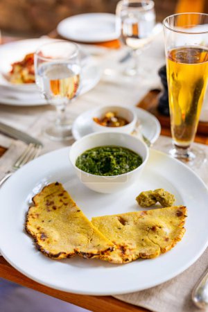 Photo for Flavours of India - freshly made roti paratha served with palak saag - Royalty Free Image