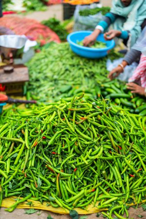 Green hot chili peppers at street vegetable market in Jaipur India