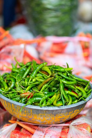 Green hot chili peppers at street vegetable market in Jaipur India