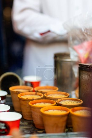 Photo for Masala chai traditional Indian drink in terracotta earthen tumblers at street vendor stall - Royalty Free Image