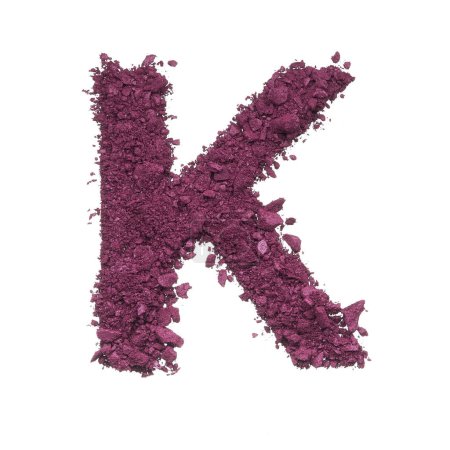 Stencil capital letter made by burgundy crushed eye shadow or broken powder isolated on white background.