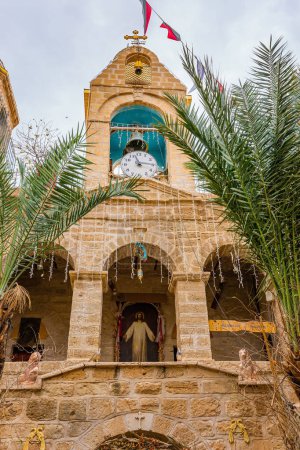 Photo for Monastery courtyard. The monastery of Gerasim of Jordan is a male monastery of the Jerusalem Orthodox Church. Israel. The monastery was built 1500 years ago. The dome and bell tower are crowned with crosses. - Royalty Free Image