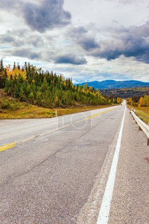 Photo for Road to Alaska. The magnificent highway is part of the Pan-American Highway, passes through North and South America. Autumn trip to the west of Canada. - Royalty Free Image