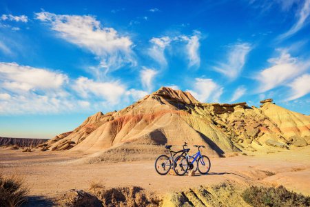 Photo for Couple of bicycles are parked. Bardenas Reales is a semi-desert area in the Spanish province of Navarre. Journey to the warm Spanish autumn - Royalty Free Image