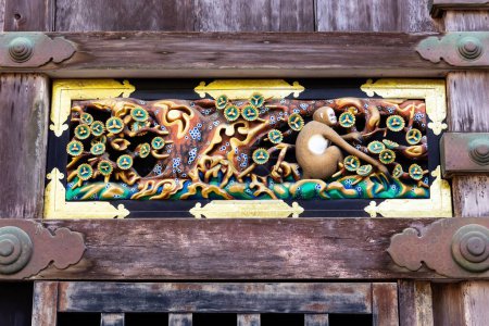 Photo for The famous carving of the Three Monkeys at the entrance to the Sacred Stable. Japan. The temple and shrine of Nikko Sunset. - Royalty Free Image