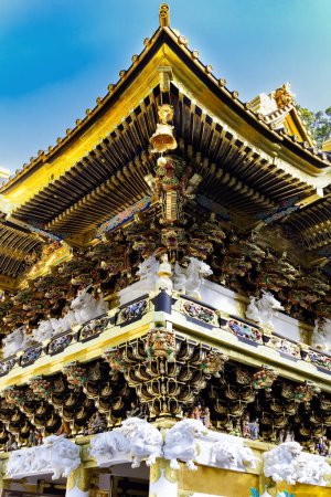 Photo for Magnificent ornate temple with gilded roof. Japan. Nikko Tosho-gu is a Shinto shrine in Nikko, built in 1617. World Heritage Site. - Royalty Free Image