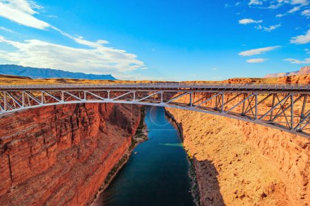 Photo for The famous Navajo bridge. Deep and narrow canyon of the Colorado River. The multicolored canyon of red Navajo sandstones. U S - Royalty Free Image