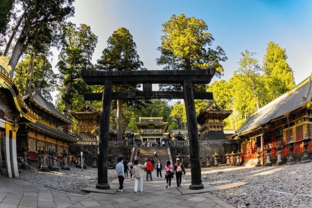 Photo for NIKKO, JAPAN, APRIL 22, 2023: The torii gate is the entrance to the sacred space where the shrine buildings are located. Shinto shrine symbol. Japan. Nikko Tosho-gu is Shinto shrine in Nikko. - Royalty Free Image
