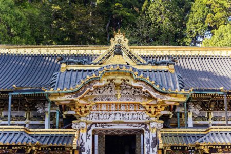 Photo for Magnificent ornate temple with gilded roof. National Treasure of Japan. World Heritage Site. Nikko Tosho-gu is a Shinto shrine in Nikko, built in 1617. - Royalty Free Image