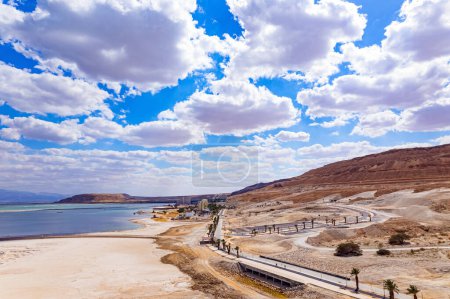 Israel. Magnificent resort for treatment and relaxation. The picturesque embankment is lined with palm trees. The Dead Sea is an endorheic salt lake. Drone filming.