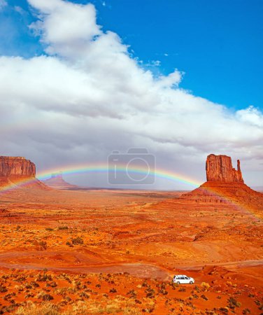 The famous rock Mitten. The bright rainbow all over the sky. Monument Valley is a unique geological formation in Arizona and Utah. USA. Navajo Indian Reservations. 