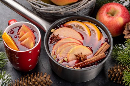 Photo for Hot mulled wine with fruits and spices - Royalty Free Image