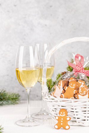 Photo for Basket with Christmas gingerbread cookies and champagne - Royalty Free Image